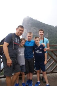 Family shot in front of the 'winged man' launchpad