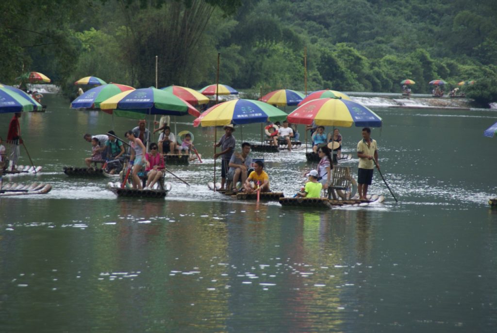 BAMBOO RAFTS DRIFTING PAST OUR HOTEL