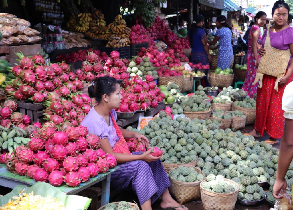 COLOURFUL FRUIT STALL AT MOUNT POPA SELLING CUSTARD APPLES AND DRAGON FRUITS