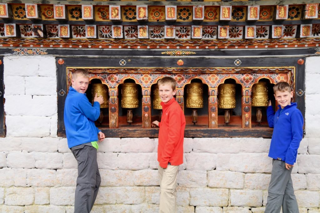 Spinning the prayer wheels at Thimphu Dzong