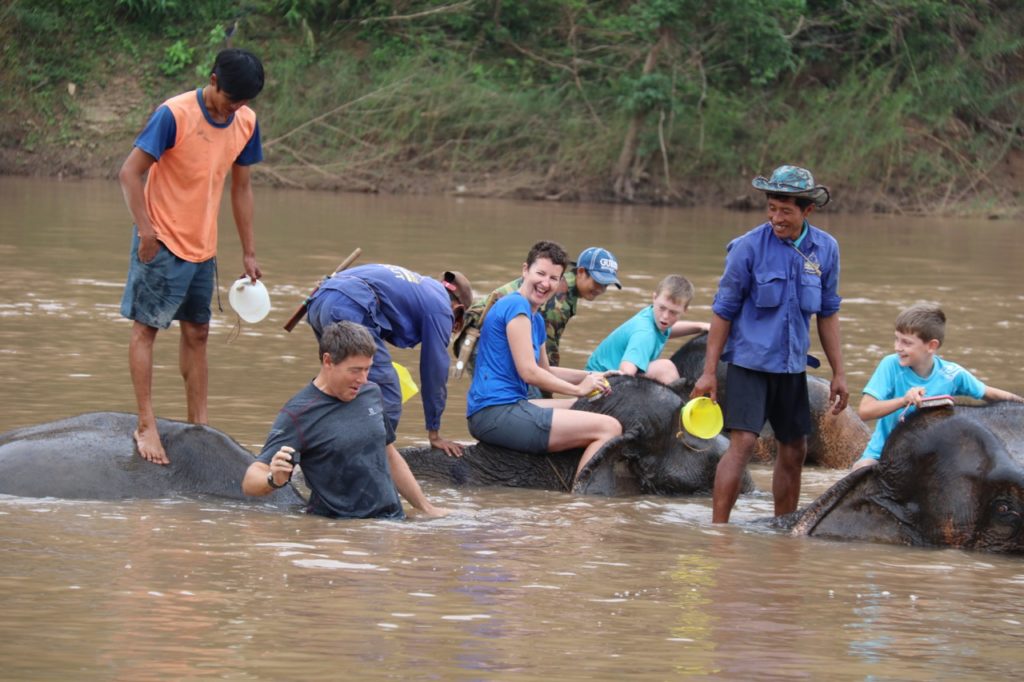 Bathing with elephants at the Elephant Village in Laos