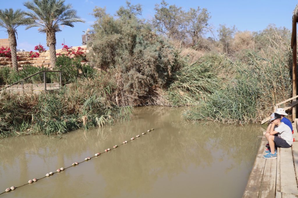 Sitting on the banks of the Jordan river at Bethany-Beyond-the-Jordan