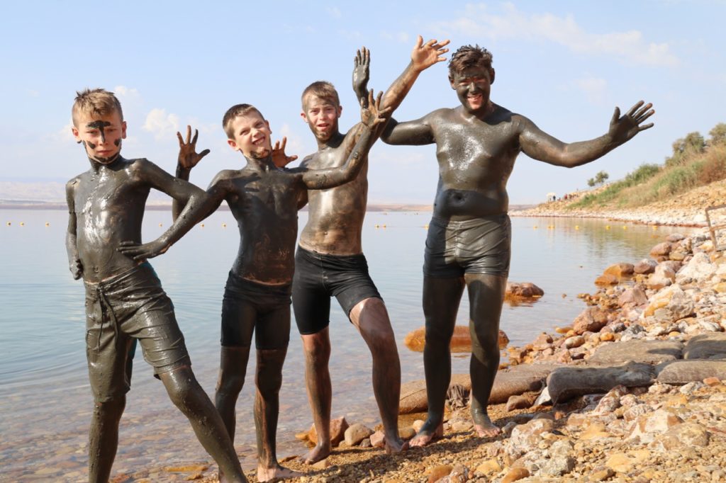 Covered in mud at the Dead Sea in Jordan