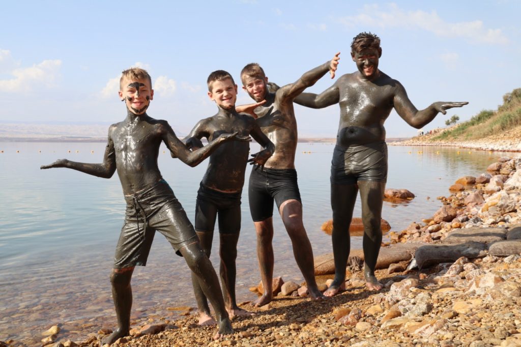 Covering ourselves in mud at the Dead Sea with children