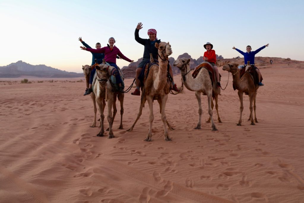 Camel riding with kids in Wadi Rum Jordan