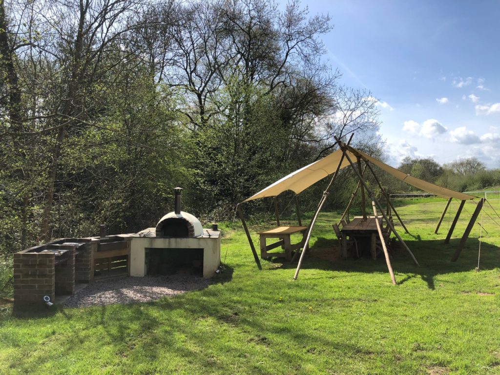 Pizza oven, BBQ and outdoor seating area at Hidden Valley Yurts