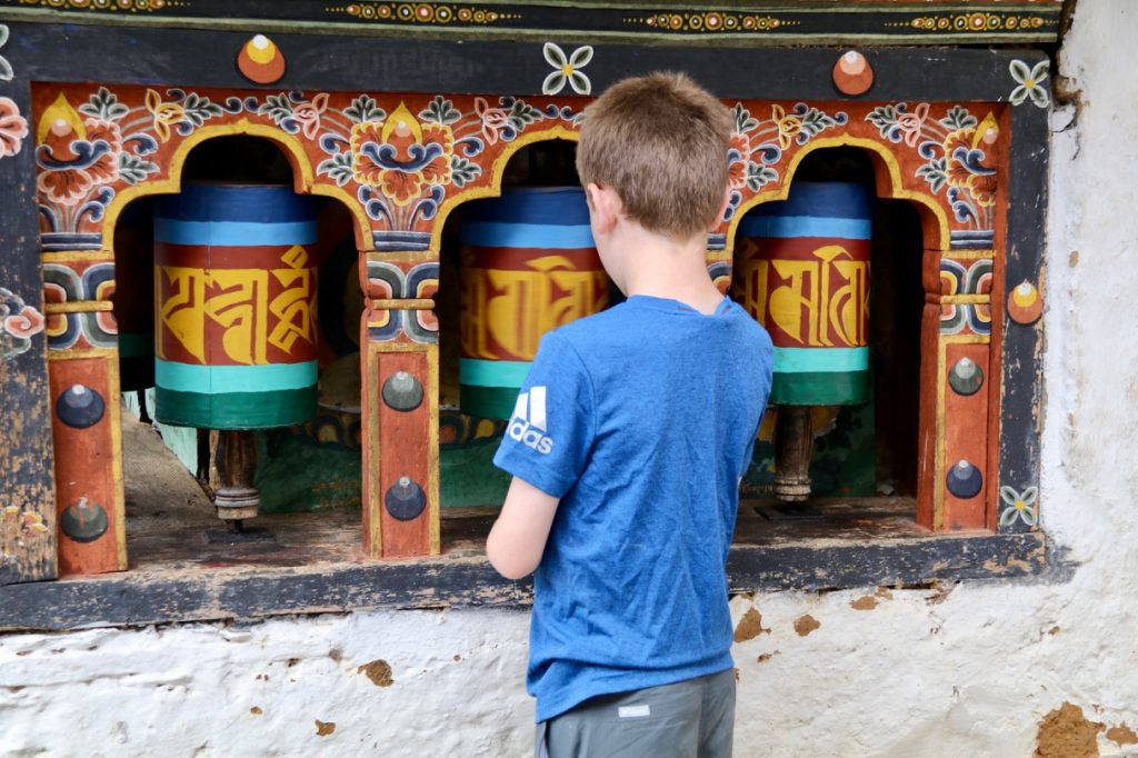 Spinning the prayer wheels at Cheri Goemba