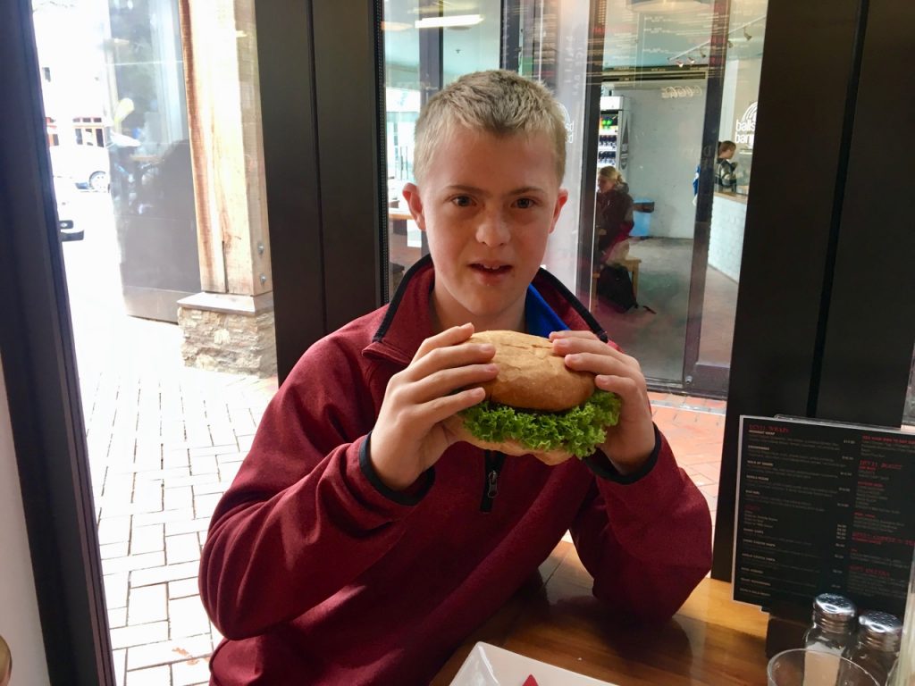 Enjoying a Devil Burger in Queenstown, New Zealand