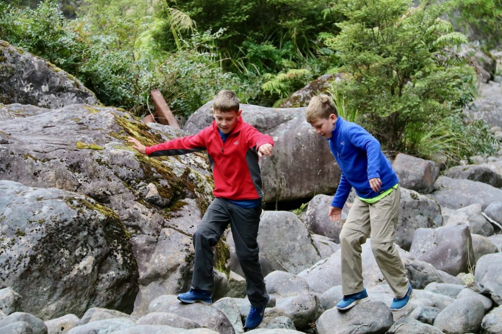 Scrambling on rocks en-route to Milford Sound