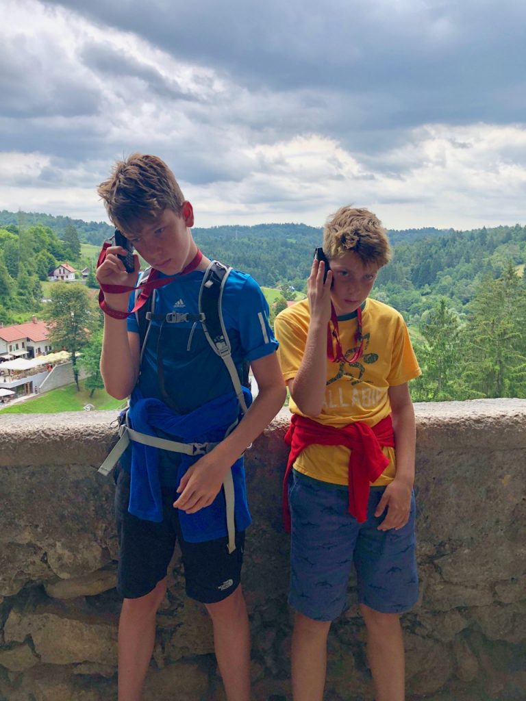 Exploring Predjama Castle with kids - listening to the audio